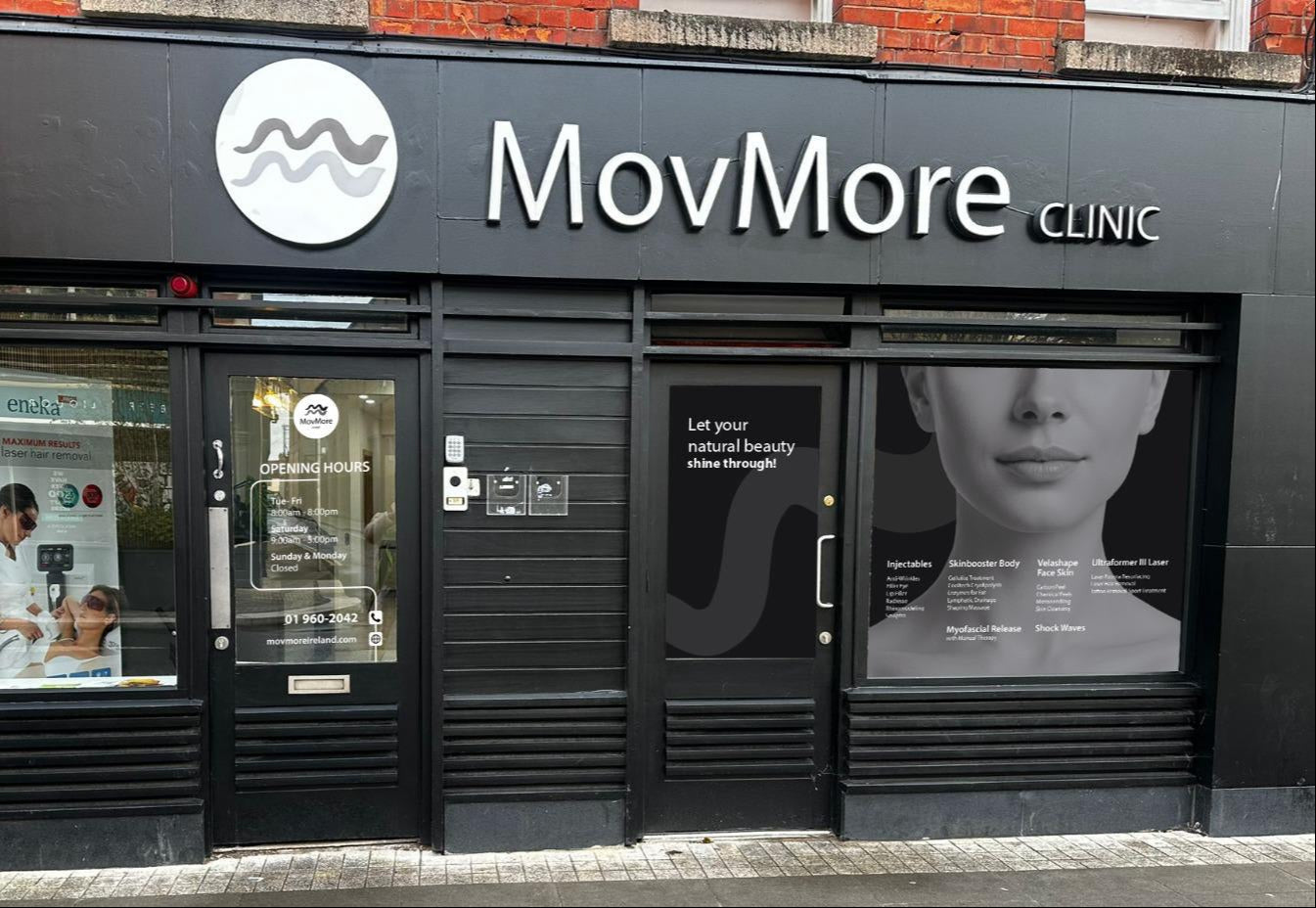 MovMore Clinic building facade with branding and glass doors.